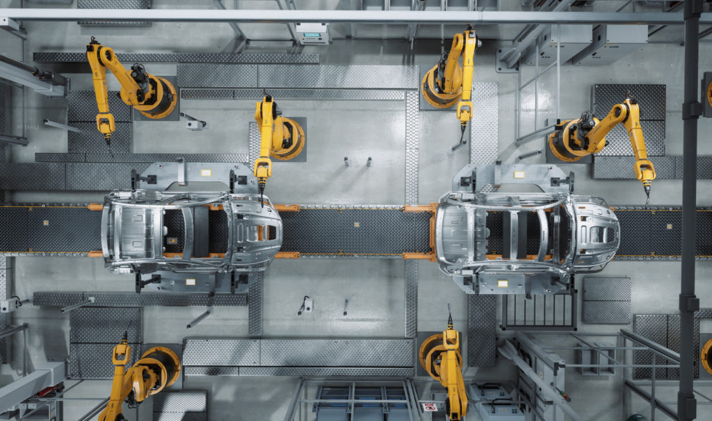 Cars being assembled in factory